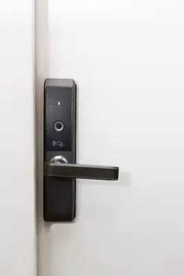 a black door lock on a white door at Loft con balcón y baño Laureles Belén TOP LOCATION in Medellín