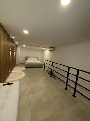 a bedroom with a bed in the middle of it at Loft lujoso en Laureles in Medellín
