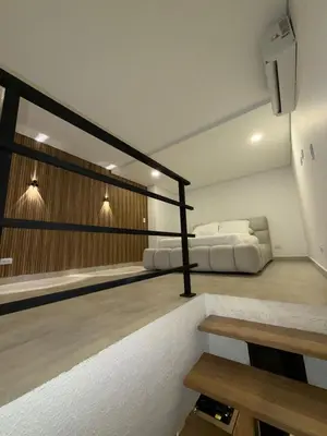 a room with two beds in a room at Loft lujoso en Laureles in Medellín