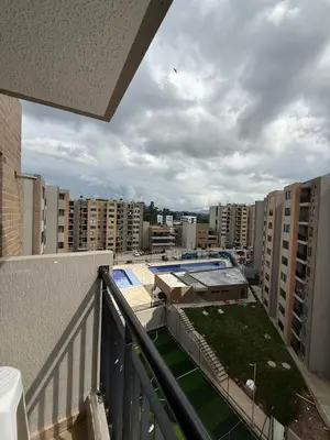 a balcony with a view of a city with buildings at Apartamento moderno balcón, Wifi, Netflix-Rionegro in Rionegro