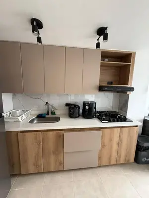 a kitchen with a sink and a stove top oven at Apartamento moderno balcón, Wifi, Netflix-Rionegro in Rionegro