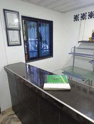 a book sitting on top of a counter at Hotel La Curva Parrilla Bar Confort in San Carlos