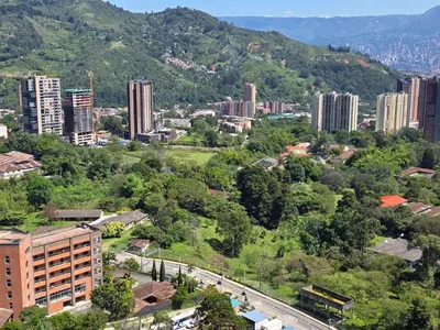 an aerial view of a city with buildings and trees at Modern sky high apartment in La Estrella in La Estrella