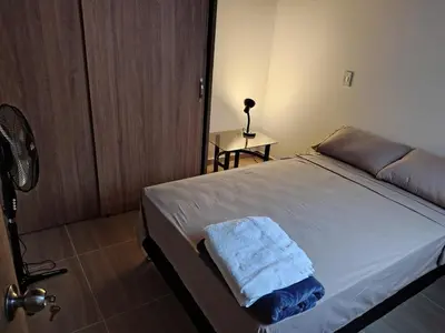 a bedroom with a bed with a towel on it at Apartamento Independiente y Completo Gran Ubicación, La 80 Belén in Medellín