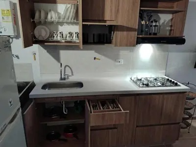 a small kitchen with a sink and a stove at Apartamento Independiente y Completo Gran Ubicación, La 80 Belén in Medellín