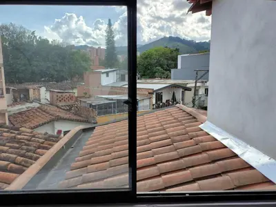 a view from a window of a roof at Apartamento Independiente y Completo Gran Ubicación, La 80 Belén in Medellín