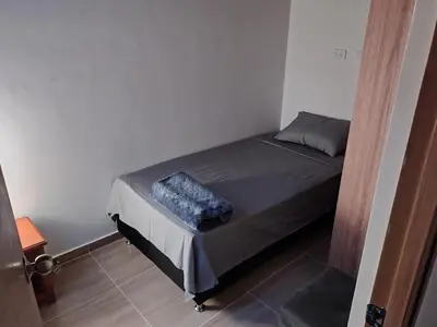 a small bedroom with a bed in a room at Apartamento Independiente y Completo Gran Ubicación, La 80 Belén in Medellín