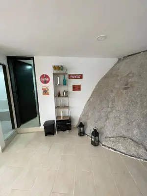 a living room with a room with a couch and a floor at Finca la cruz, frente al embalse in Chiquinquirá