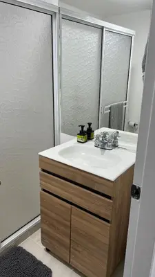 a bathroom with a sink and a mirror at Hermoso apartamento nuevo ! A un paso de la 70 zona vip in Medellín