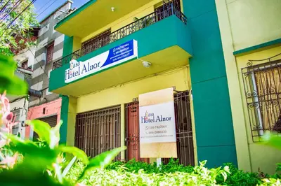 a building with a sign on the side of it at Hostel North SAS in Medellín