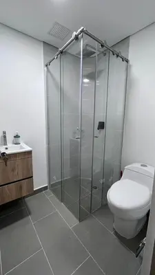 a bathroom with a shower and a toilet at Alojamiento entero loft en Medellin, Estadio in Medellín