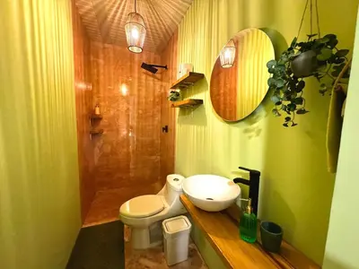 a bathroom with a toilet and a sink and a shower at Co404 Medellin - Coliving Coworking in Medellín