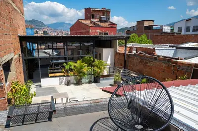 a bench sitting on the roof of a building at Co404 Medellin - Coliving Coworking in Medellín