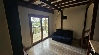 a living room with a couch and a window at Aitana Mágica in Copacabana