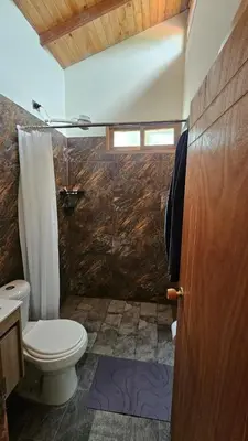 a bathroom with a toilet and a sink and a shower at Aitana Mágica in Copacabana