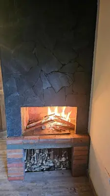 a brick oven with a fire inside of it at Aitana Mágica in Copacabana