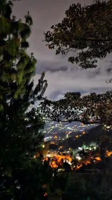 a view of a city at night with trees at Aitana Mágica in Copacabana