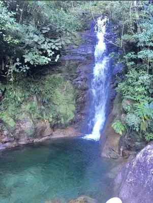 a waterfall in the middle of a pool of water at WalApar in San Rafael