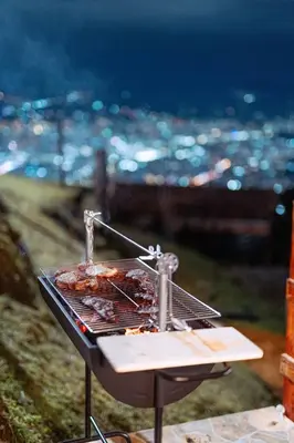 a grill with some food on top of it at Charlotte Alojamiento in Medellín