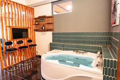 a bathroom with a jacuzzi tub in a room at Charlotte Alojamiento in Medellín