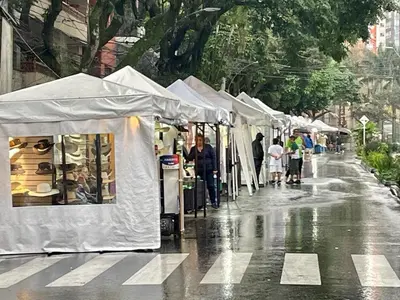 a group of tents on a street in the rain at exclusive pink zone sabaneta friends and fun in Sabaneta