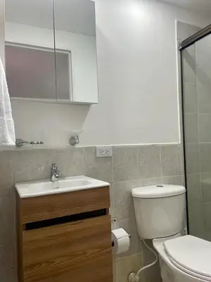a bathroom with a white toilet and a sink at exclusive pink zone sabaneta friends and fun in Sabaneta