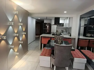 a kitchen and living room with a table and chairs at Refugio Sereno en Itagüí in Itagüí