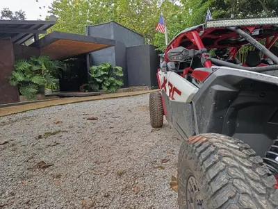 a truck parked in front of a house at Madeira Majestic Hotel in Doradal