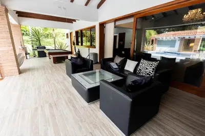 a living room with two couches and a table at Finca la Princesa Eastern Antioquia in Carmen de Viboral