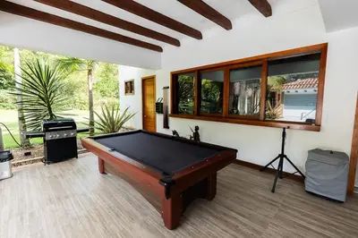 a pool table in the middle of a room at Finca la Princesa Eastern Antioquia in Carmen de Viboral