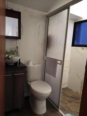 a bathroom with a toilet and a sink at Hermoso apartamento en la Dalia Marinilla Antq in Marinilla