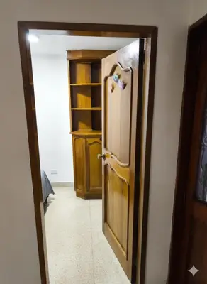an open door to a room with a closet at Cama nueva doble con balcón cerca del parque principal in La Ceja