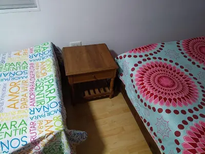 a living room with a couch and a table at Hostal Villa Café in Manizales