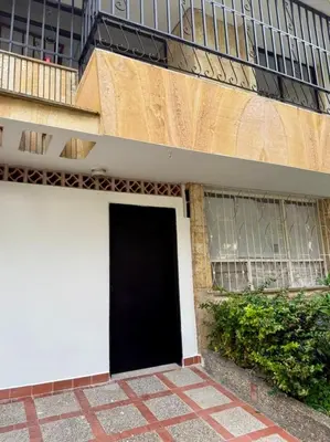 a black door on the side of a building at Loft Medellin a Dos Calles del Estadio in Medellín