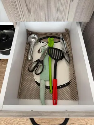 a white drawer filled with utensils in a drawer at Descansa, comodidad y confort in Manizales