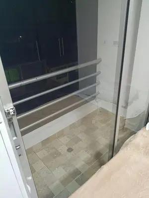 a glass door to a room with a window at Hostal Villa Café in Manizales