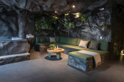 a living room with a couch and a table at The rock complete apartment in Medellín