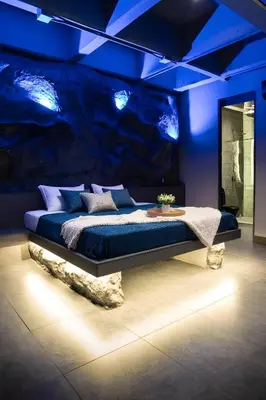 a bedroom with a bed with a blue ceiling at The rock complete apartment in Medellín
