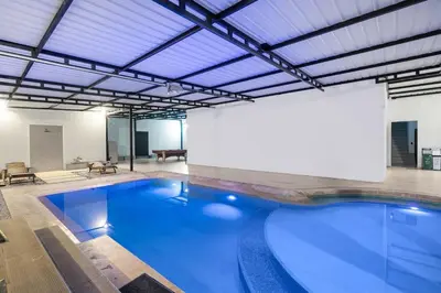 a large swimming pool in a building at Ph volcana in Medellín
