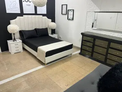 a bedroom with a bed and a dresser and a mirror at Group stay 21 guests, WiFi 900 Mb in Medellín