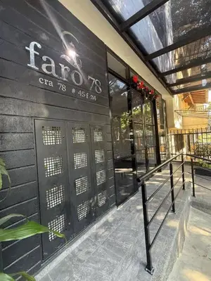 a building with a sign on the side of it at Modern and cozy apartment - Laureles Estadio in Medellín