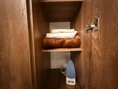 a room with a door with a closet with towels at Modern and cozy apartment - Laureles Estadio in Medellín