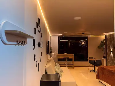 a living room with lights on the wall at Modern and cozy apartment - Laureles Estadio in Medellín