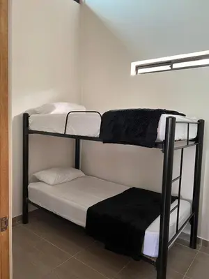 a room with two bunk beds in a room at Casa Finca en Guatapé in Guatapé