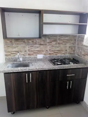 a kitchen with a sink and a stove at VILLA La May in Medellín