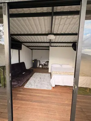 a bedroom with two beds under a canopy at Chocochucho Agroecoturismo in Amalfi