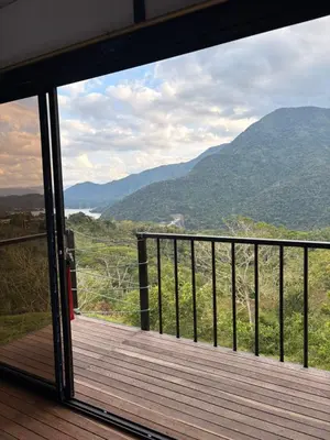 a room with a balcony with a view of mountains at Chocochucho Agroecoturismo in Amalfi