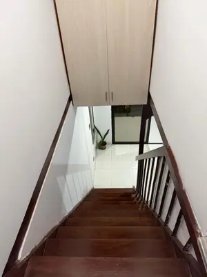 a stairway with a cabinet on top of it at Apartamento Comuna 13 in Medellín