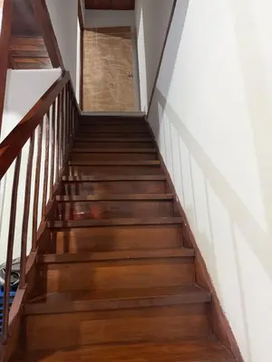 a staircase leading up to the second floor of a house at Apartamento Comuna 13 in Medellín