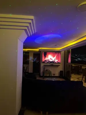 a living room with a couch and a tv at Lu alojamiento parque caldas in Manizales